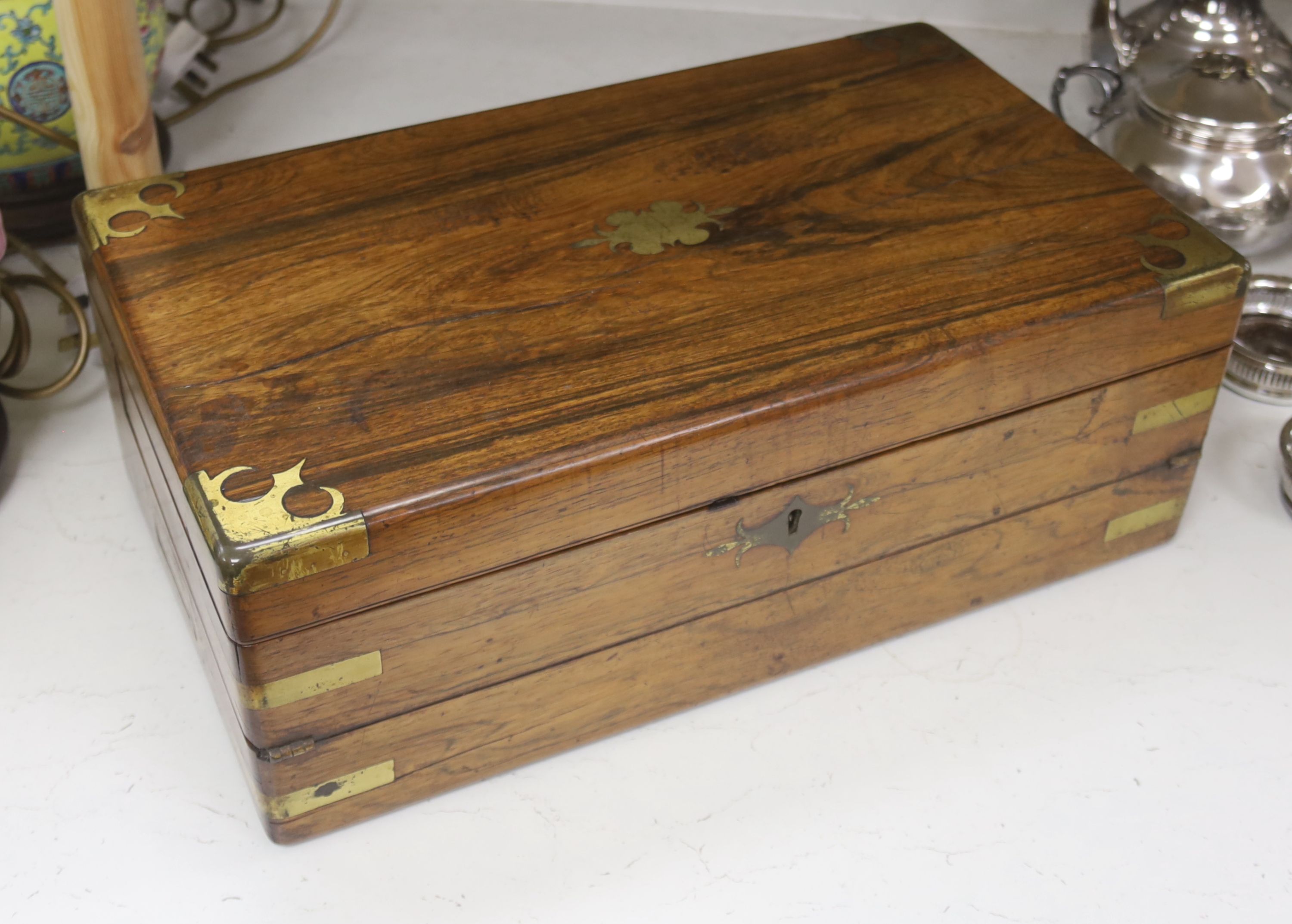 An early Victorian brass bound rosewood writing box